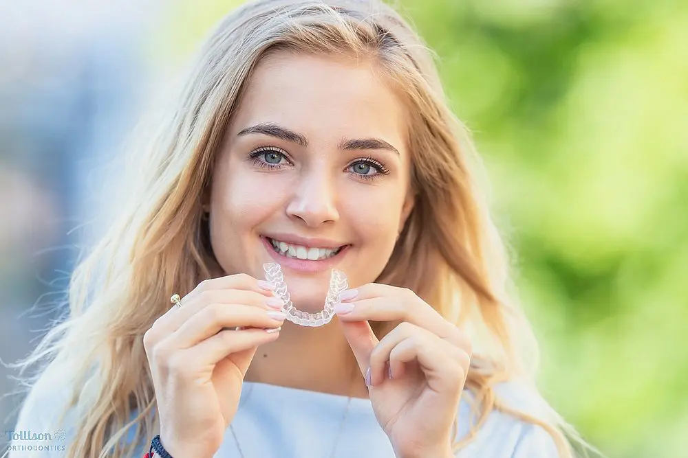 invisalign clear aligners orthodontics concept young attractive woman - How Long Does Invisalign Take in Greenville, SC